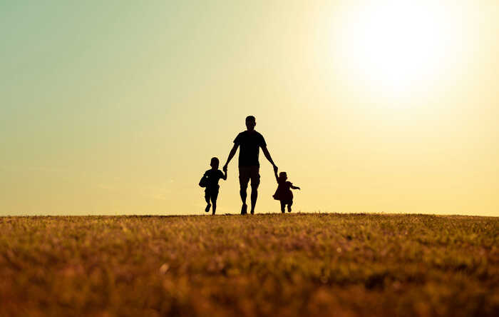 father and children on a walk